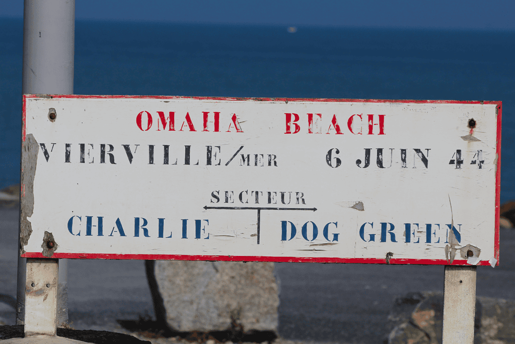 A sign marking Charlie and Dog Green beach sectors of Omaha Beach for an article covering 10 interesting facts about D-day.