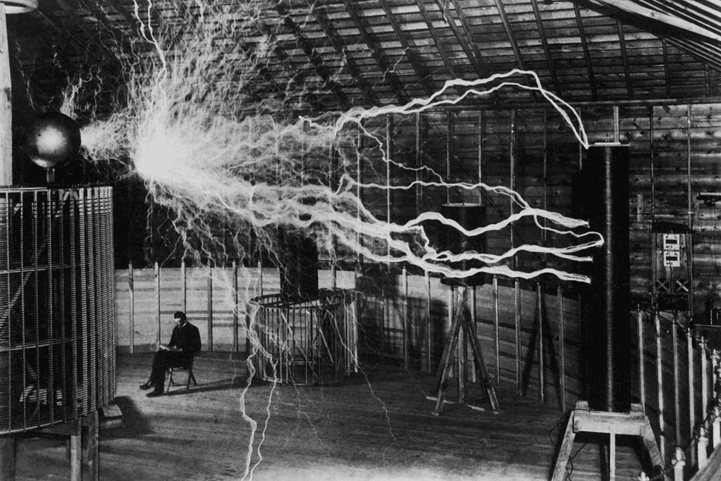 Image of Nikola Tesla conducting an electrical transmission experiment for a blog post covering Tesla's greatest inventions.